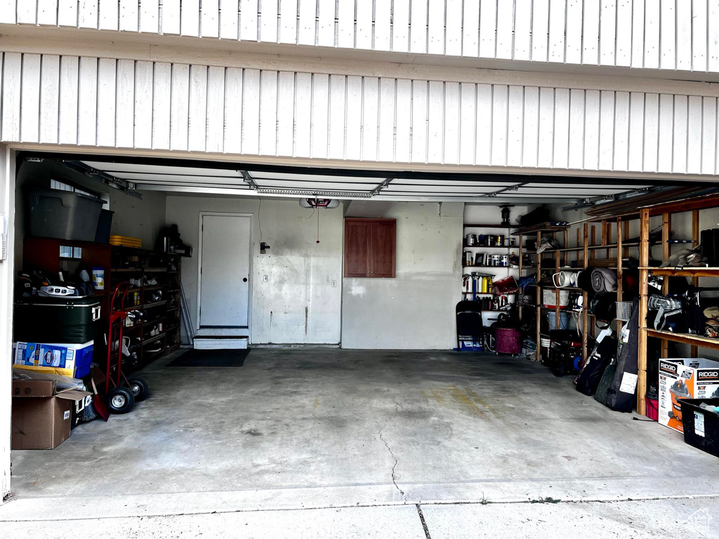 Garage featuring a garage door opener