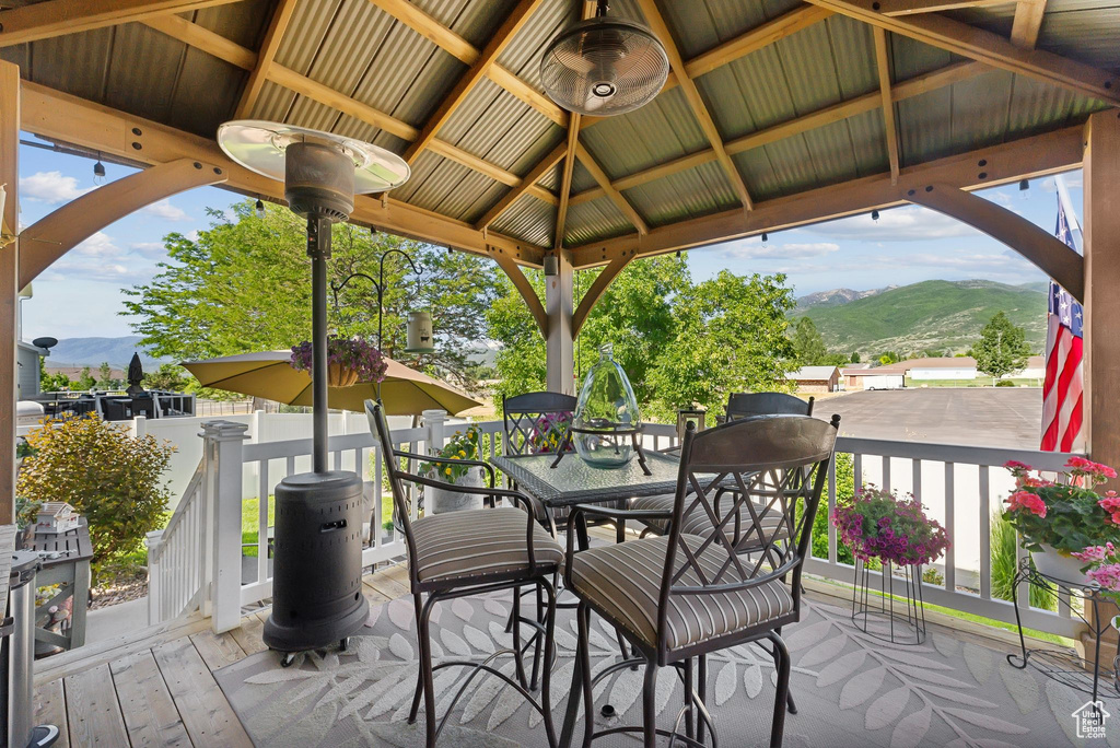 Deck with a mountain view and a gazebo