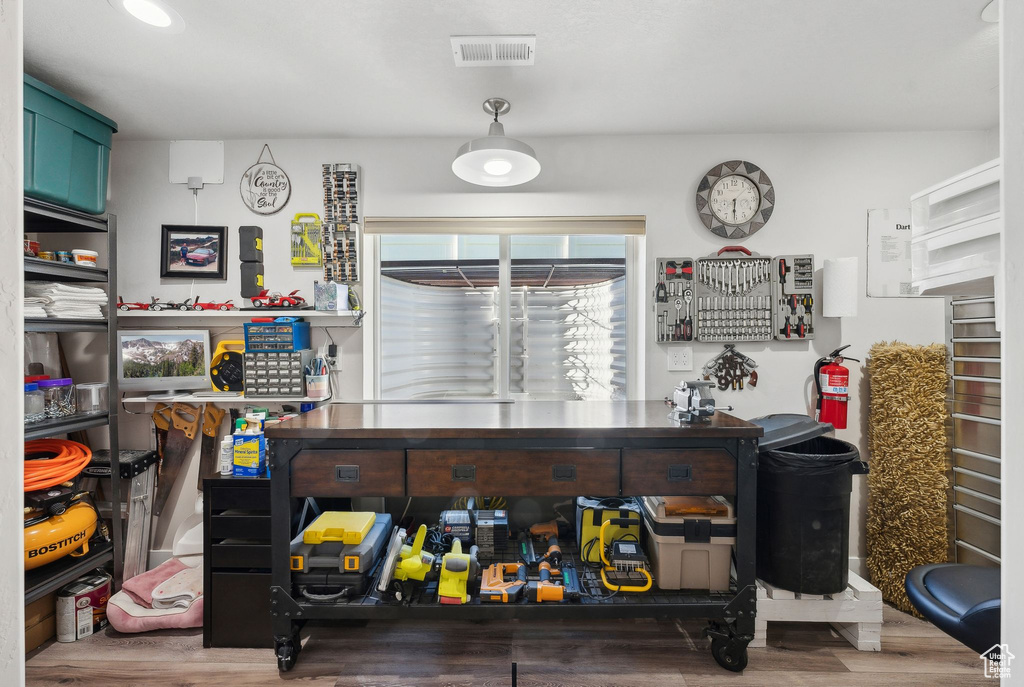 Bar with hardwood / wood-style flooring