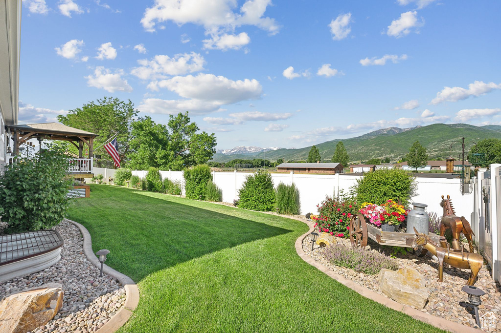 View of yard with a gazebo and a mountain view