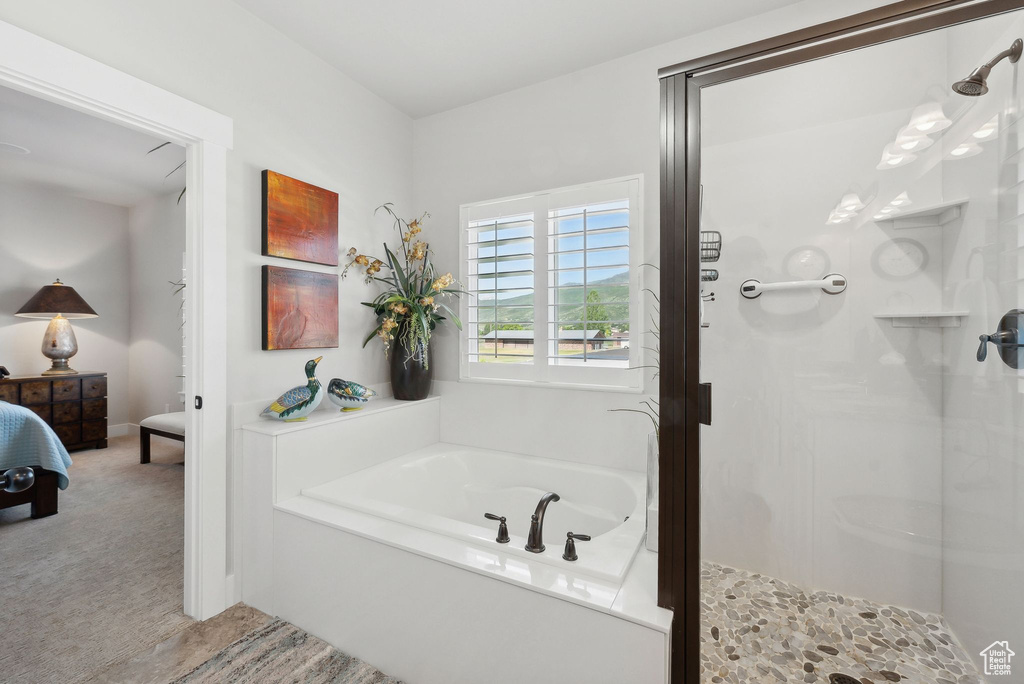 Bathroom featuring independent shower and bath