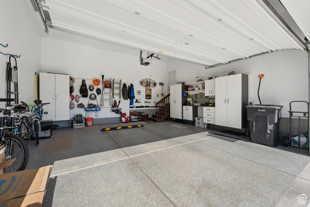 Garage featuring a garage door opener