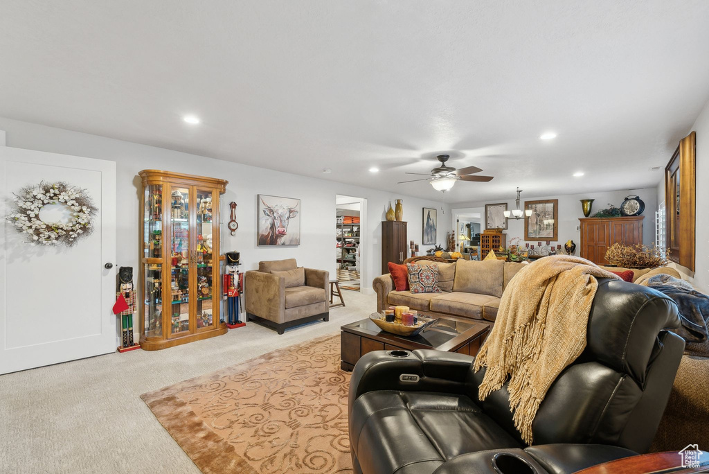 Living room with light carpet and ceiling fan