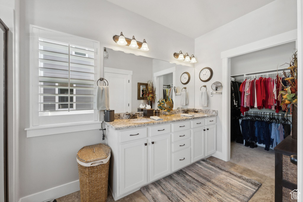 Bathroom featuring double vanity