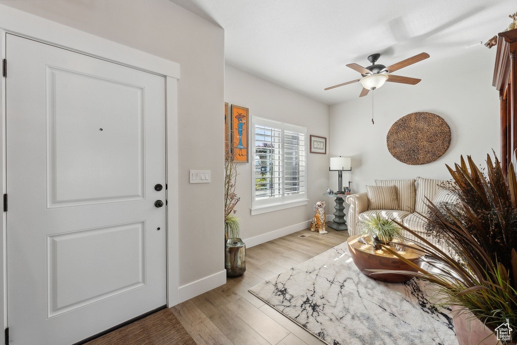 Entryway featuring ceiling fan and light hardwood / wood-style flooring