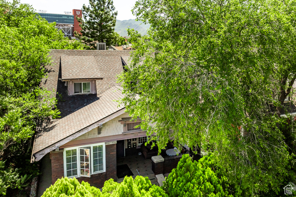 View of side of property with an outdoor hangout area and a patio area