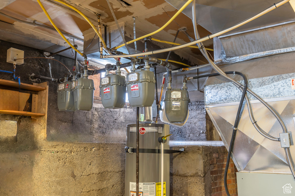 Utility room featuring water heater