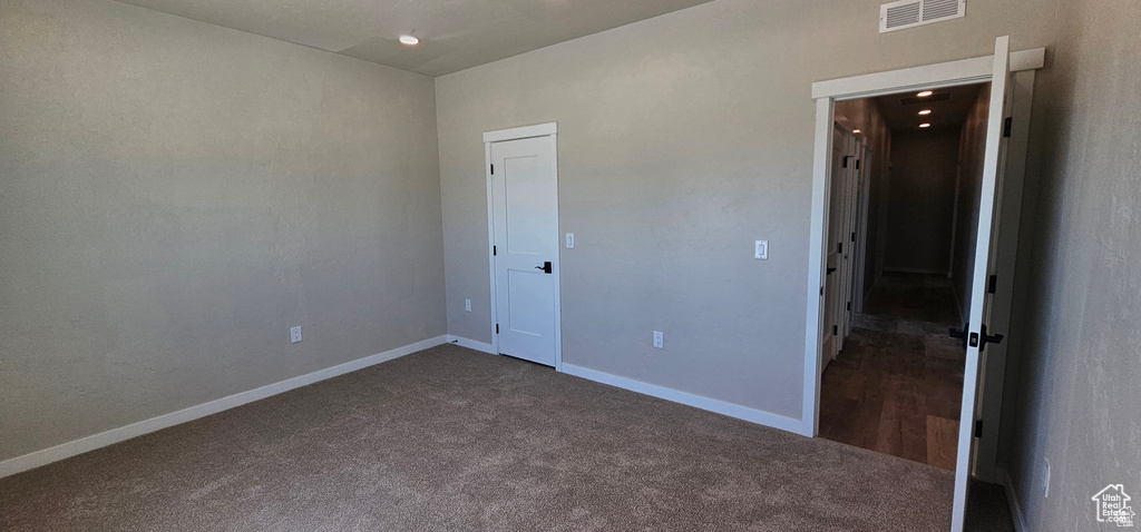 Unfurnished bedroom with carpet floors