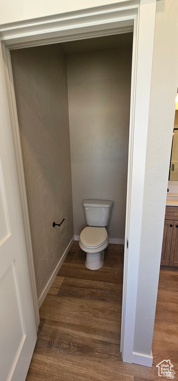 Bathroom featuring toilet and hardwood / wood-style floors