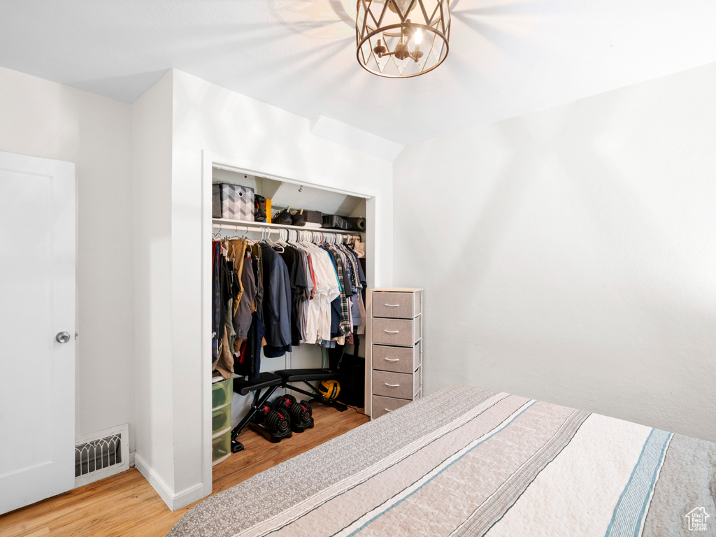 Bedroom featuring a closet and light hardwood / wood-style floors