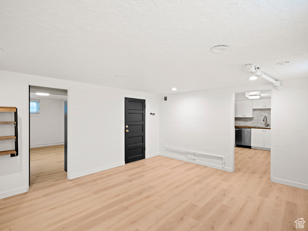 Interior space featuring sink and light wood-type flooring