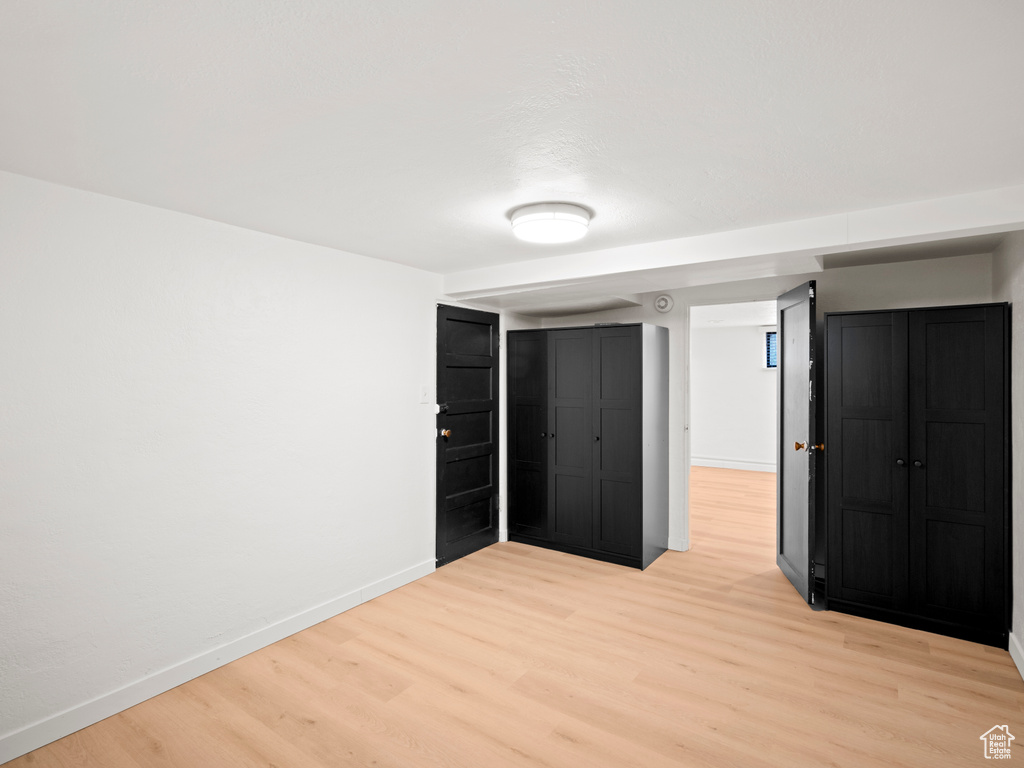 Unfurnished bedroom featuring light hardwood / wood-style floors