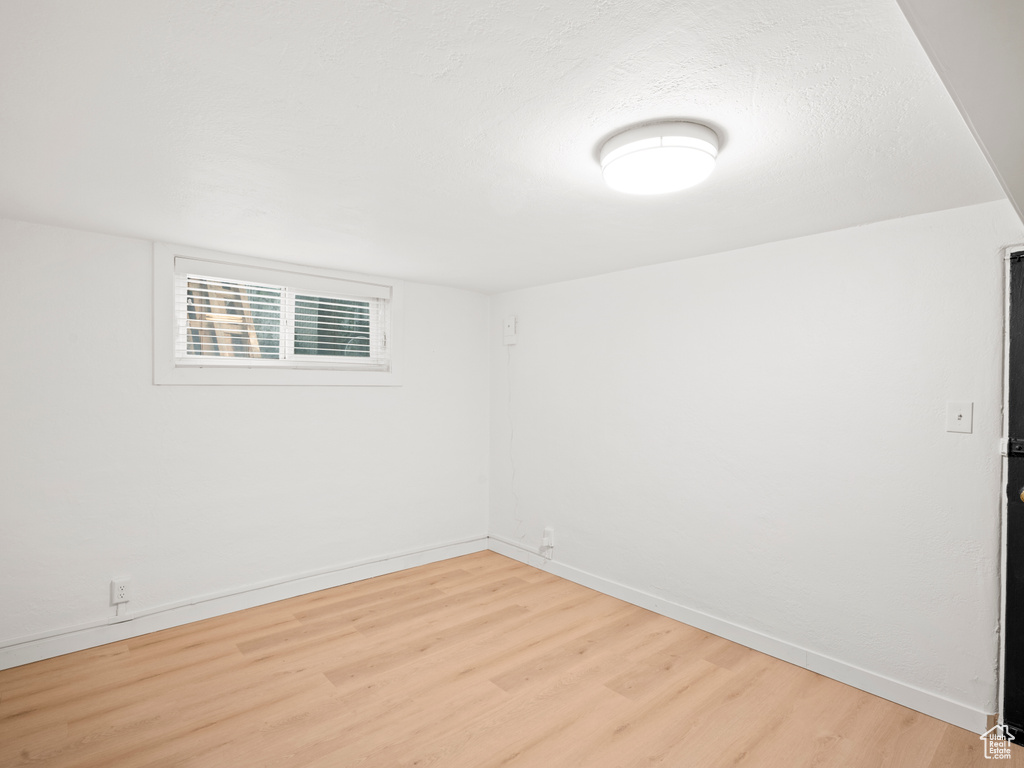 Unfurnished room with light wood-type flooring