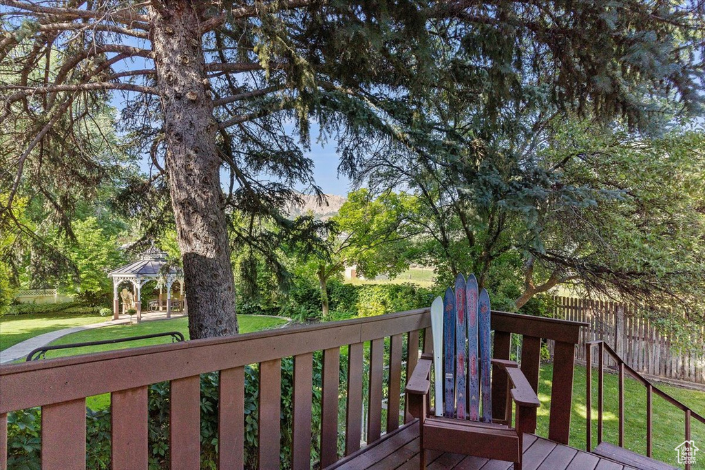 Wooden deck featuring a gazebo