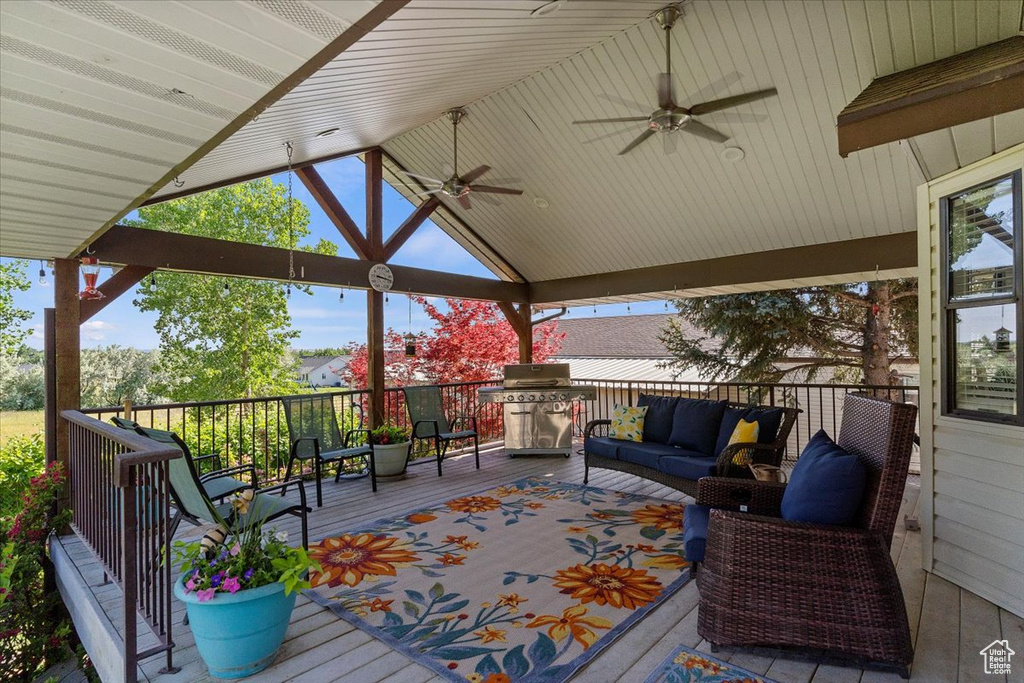 Deck featuring ceiling fan and a gazebo