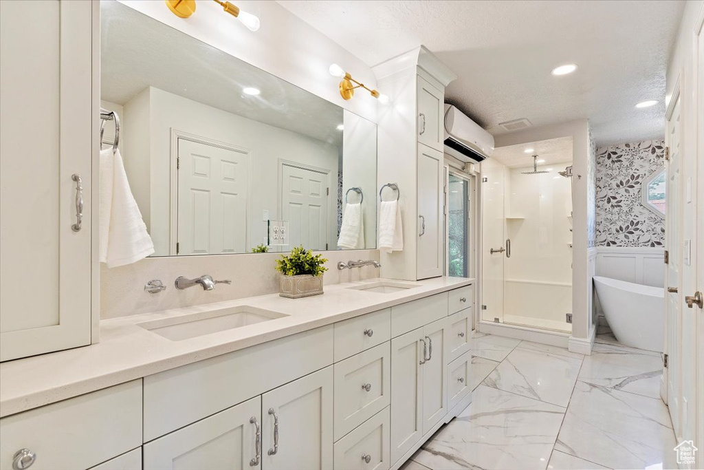 Bathroom with tile floors, an enclosed shower, and dual bowl vanity