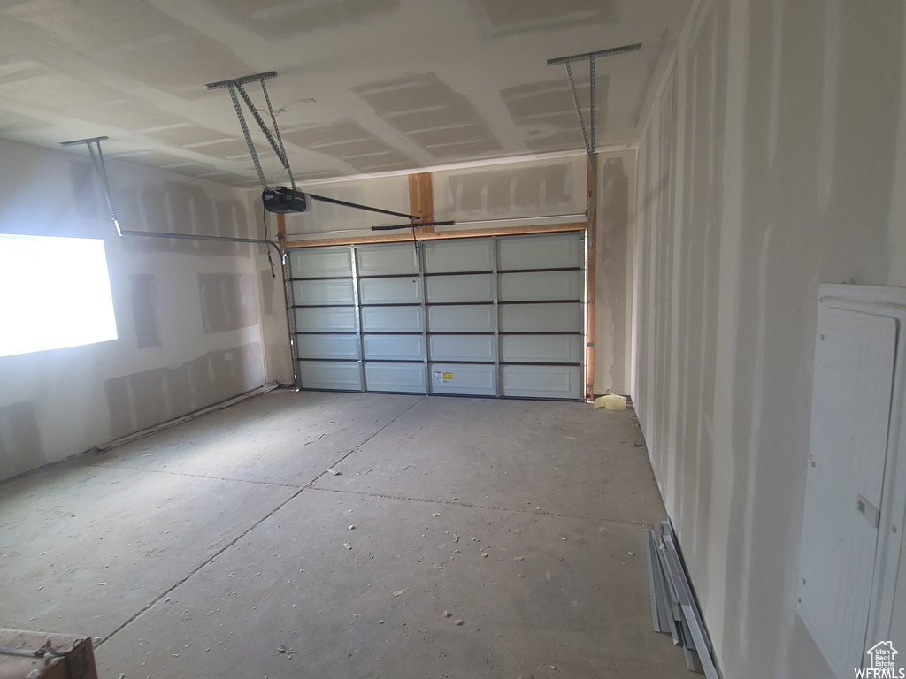 Garage featuring a garage door opener