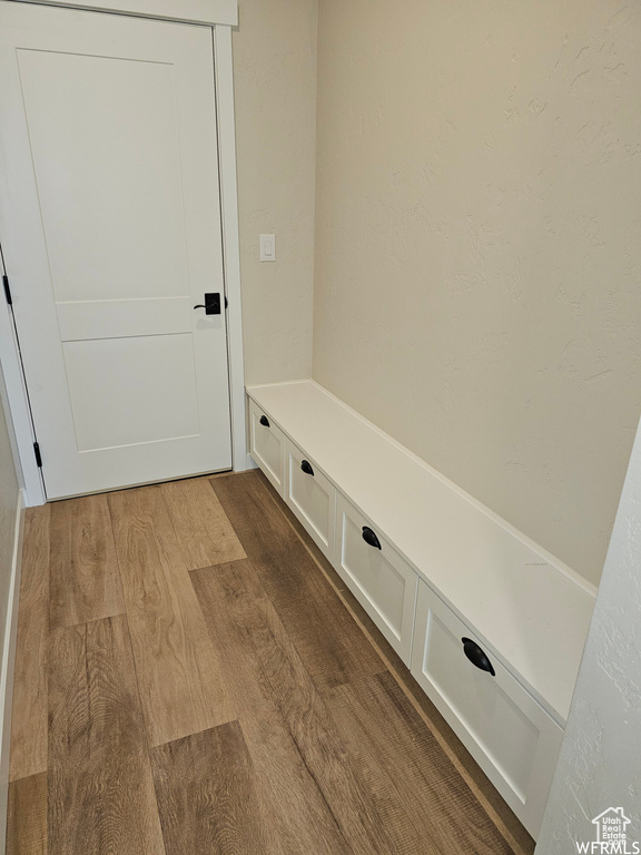 Mudroom with wood-type flooring