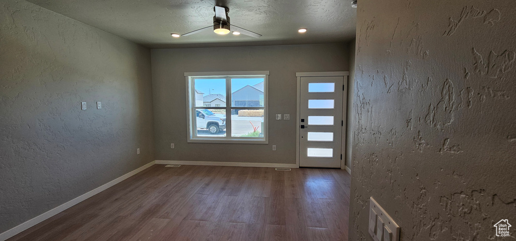 Foyer entrance featuring hardwood / wood-style flooring, a textured ceiling, and ceiling fan