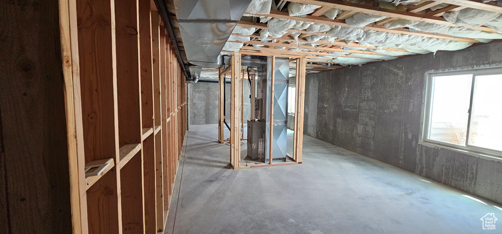 Basement with heating unit and a wealth of natural light