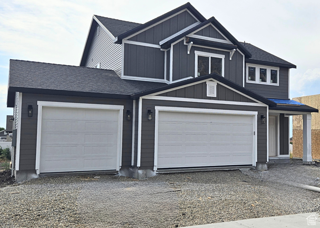 View of front of property with a garage