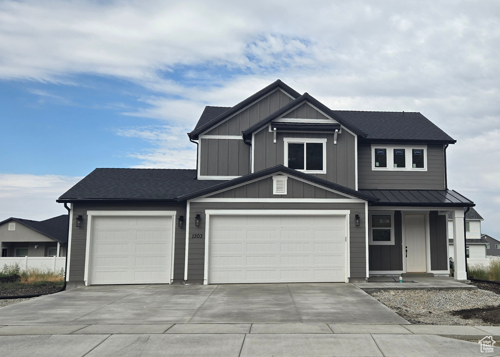 View of front of property featuring a garage