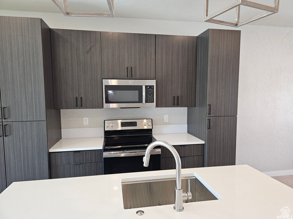 Kitchen with stainless steel appliances and sink