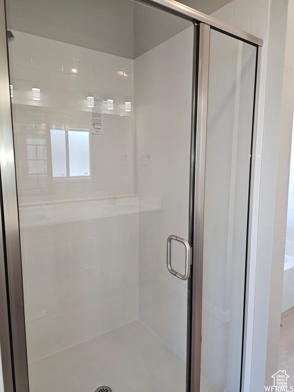 Bathroom with a shower with shower door