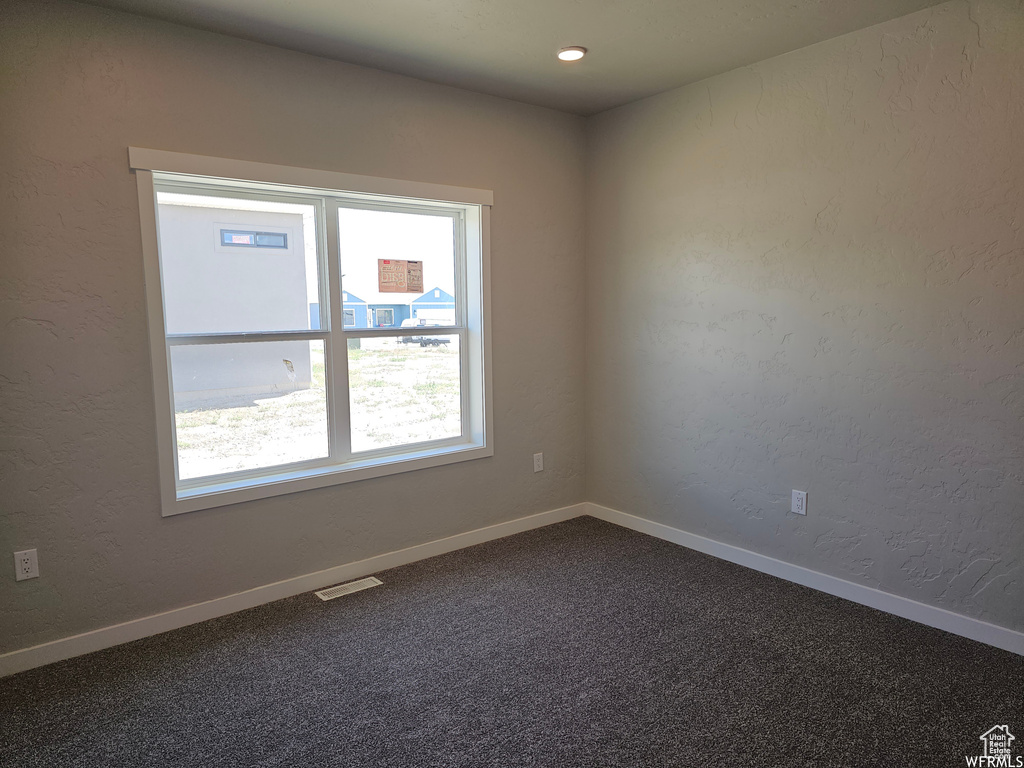 View of carpeted spare room