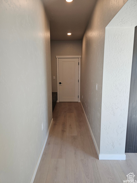 Corridor featuring hardwood / wood-style floors