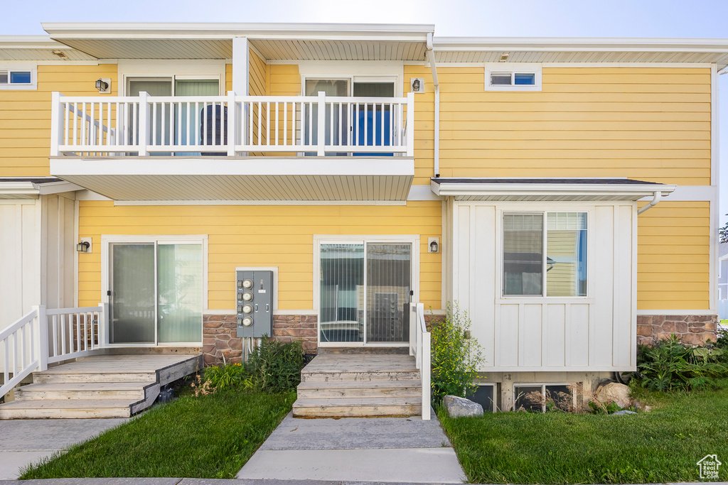 View of property with a balcony