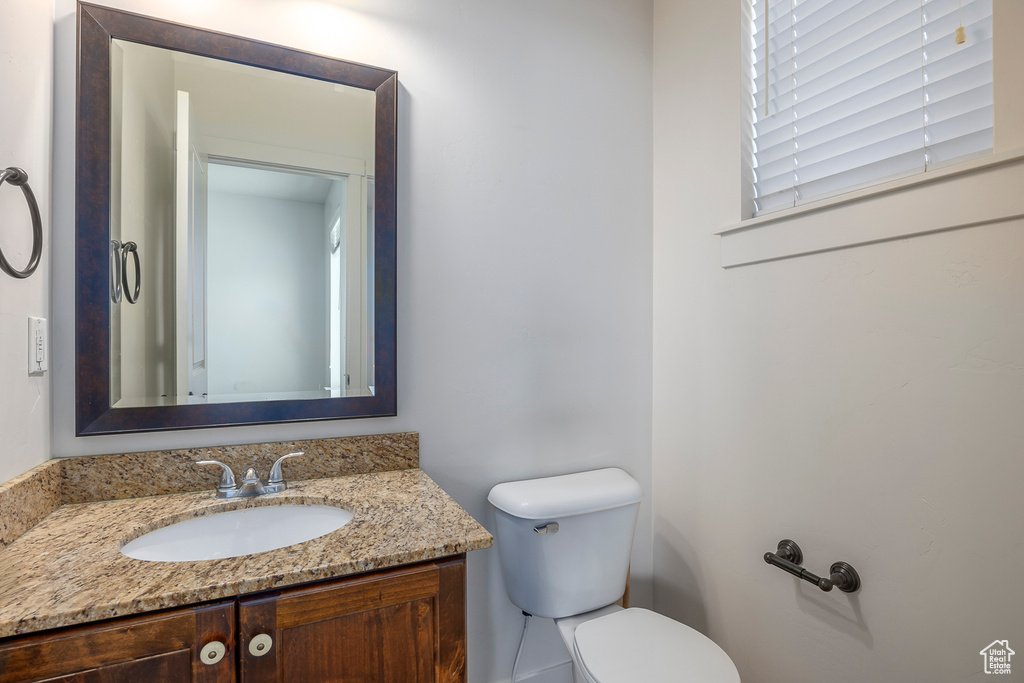 Bathroom featuring vanity and toilet