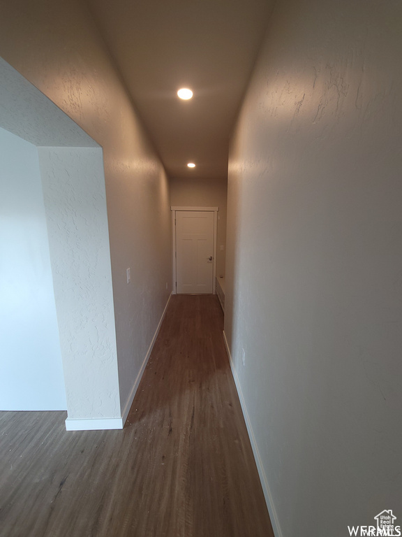 Hallway featuring dark hardwood / wood-style flooring