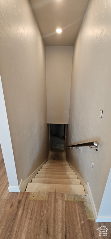 Stairway with hardwood / wood-style flooring