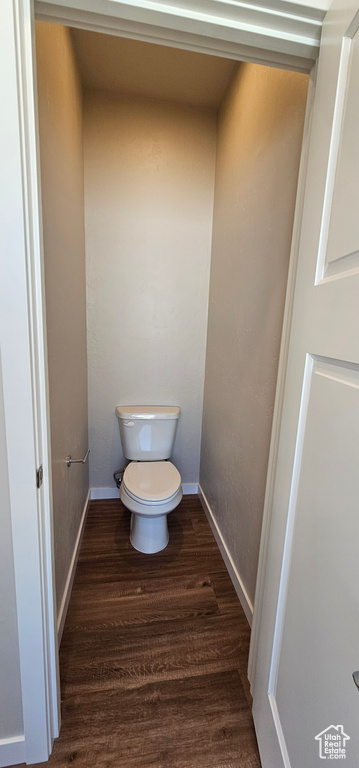 Bathroom featuring toilet and hardwood / wood-style flooring