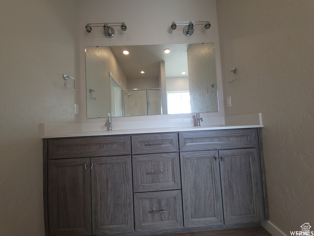 Bathroom featuring double sink vanity