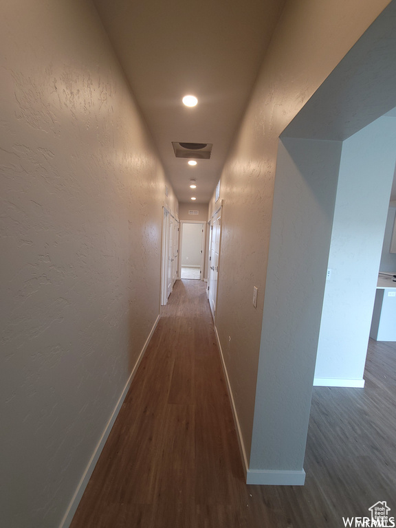 Corridor with dark wood-type flooring