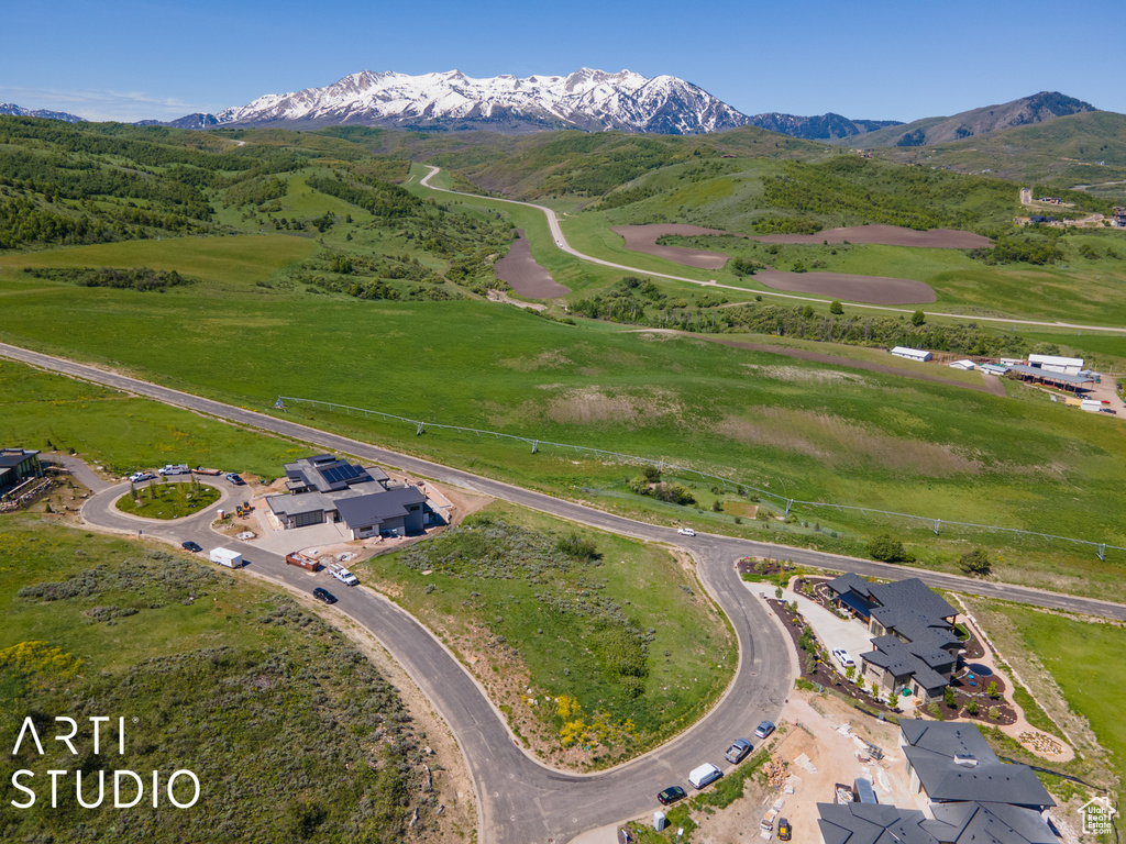 Birds eye view of property with a mountain view