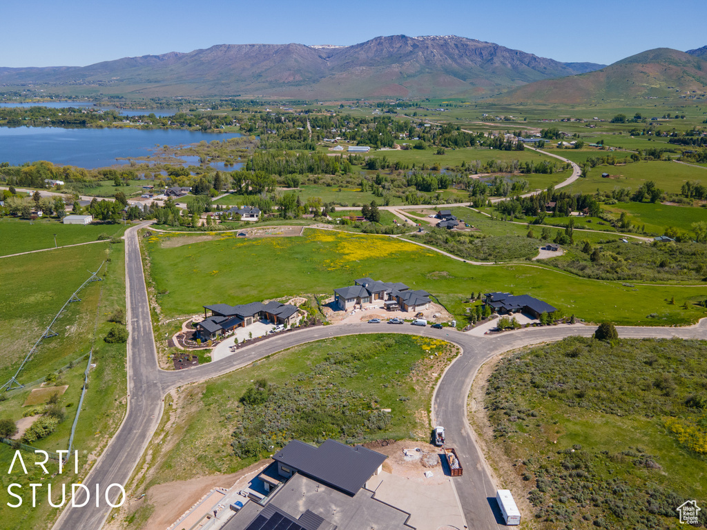 Aerial view featuring a water and mountain view