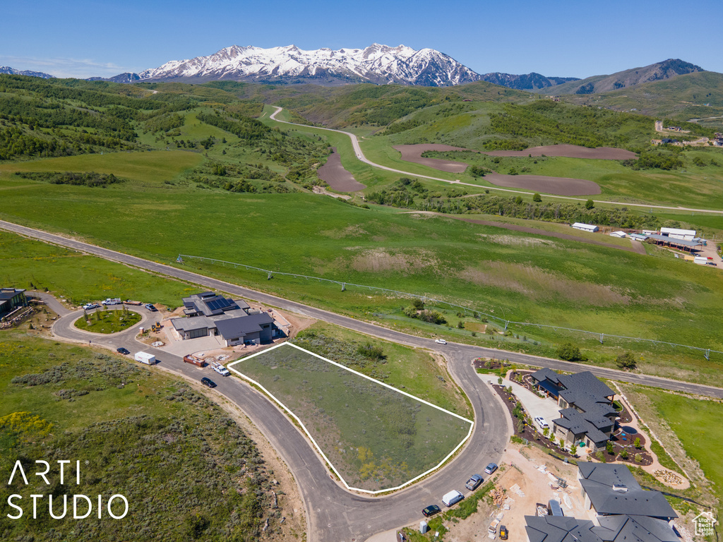 Birds eye view of property with a mountain view
