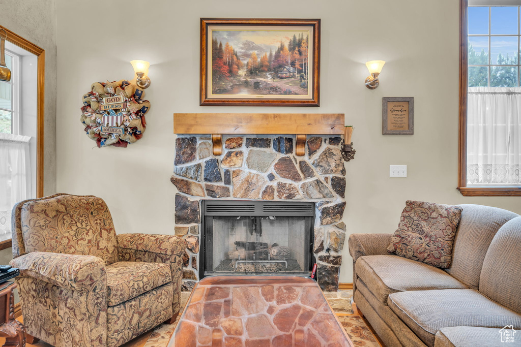 Living room featuring a fireplace and plenty of natural light