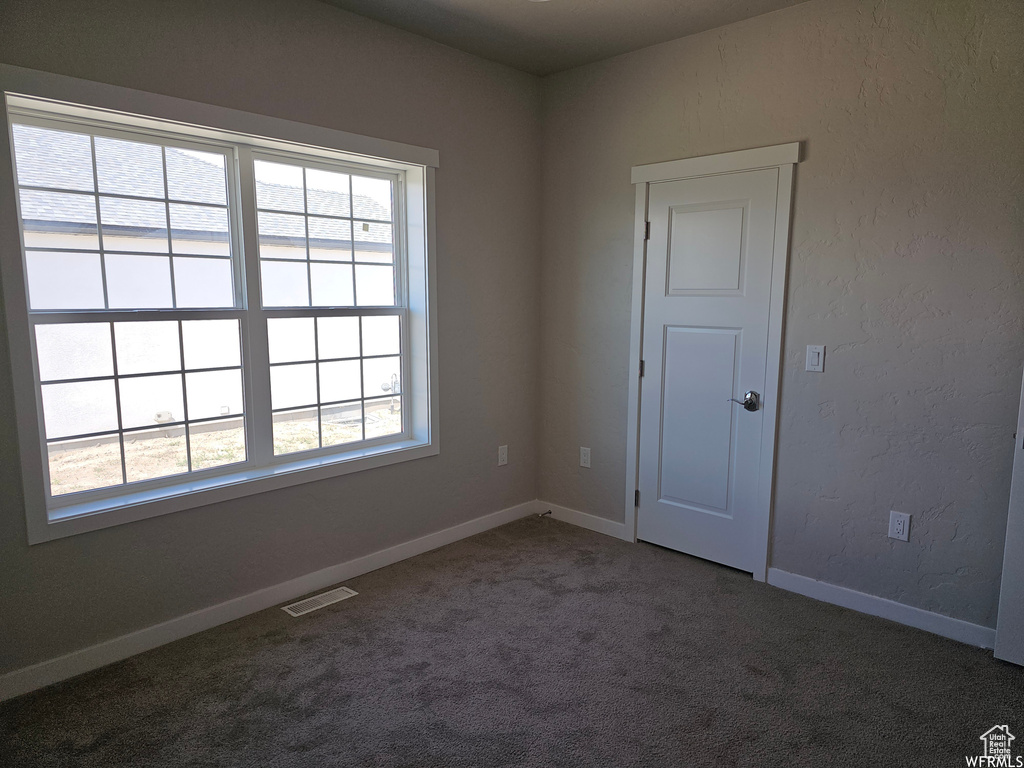 Empty room featuring carpet