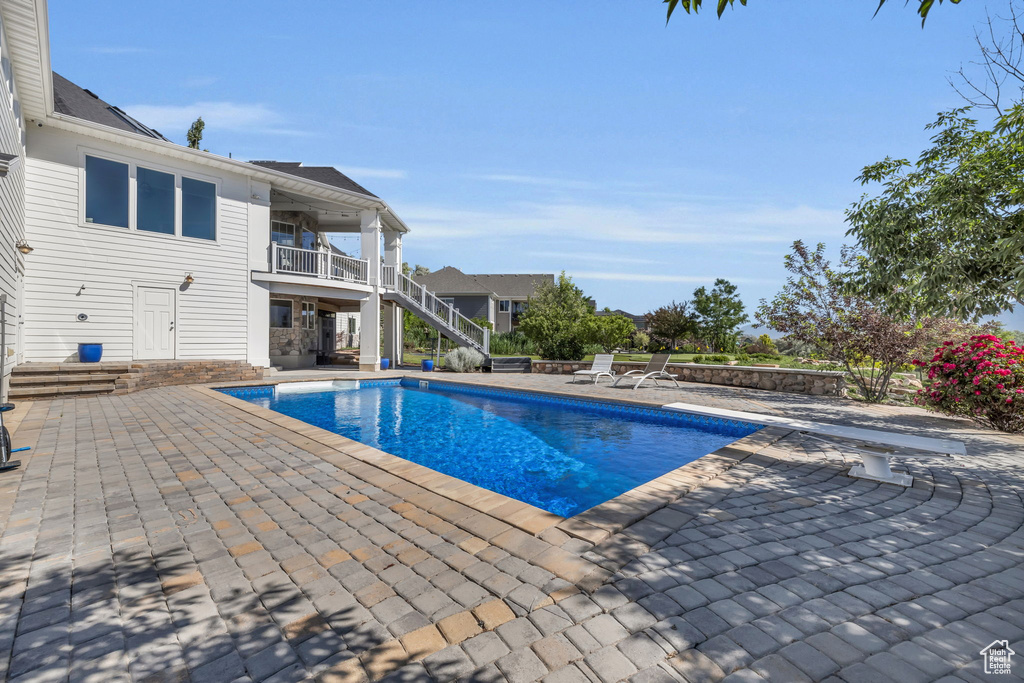 View of swimming pool with a patio area