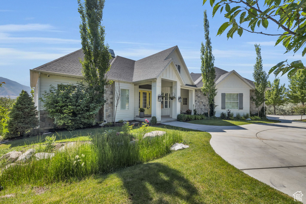 View of front of house with a front yard