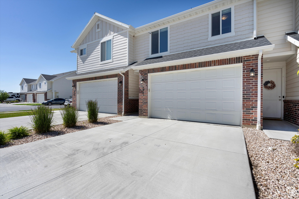 View of front of property featuring a garage