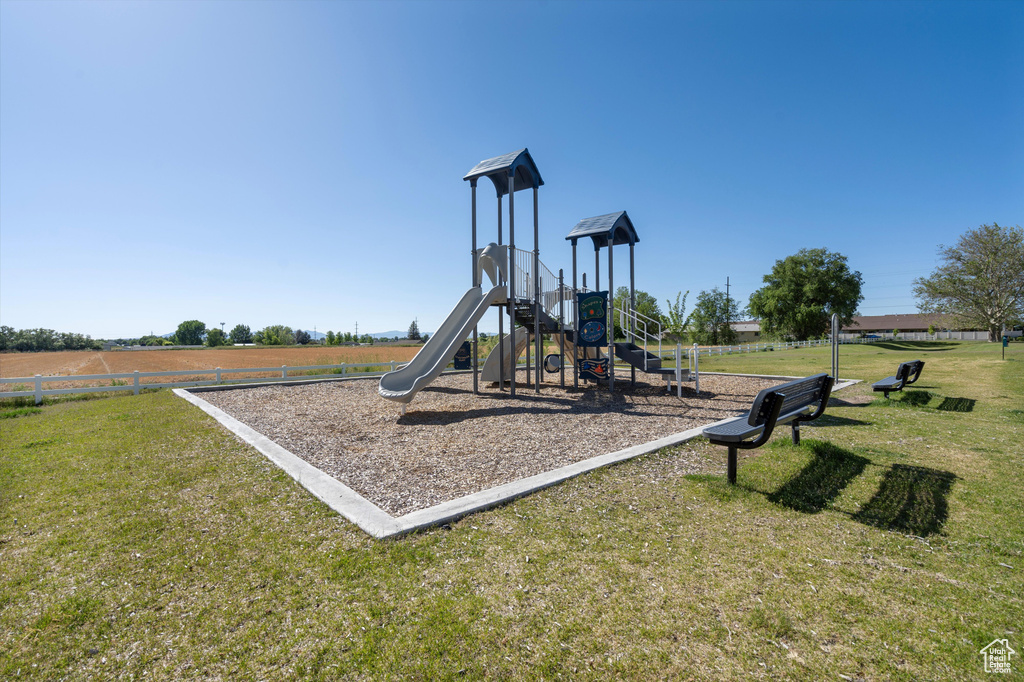 View of play area featuring a lawn