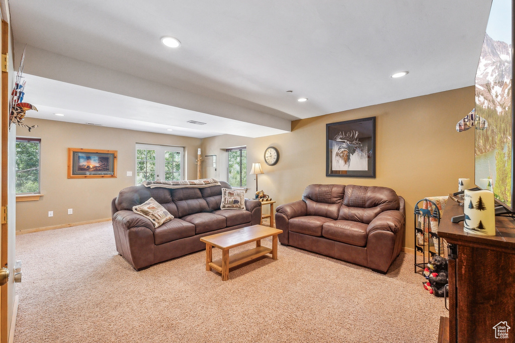 Living room with french doors and carpet floors