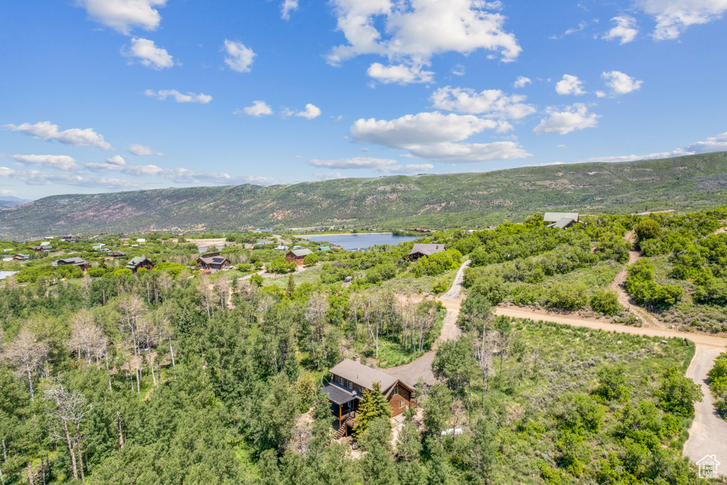 Bird's eye view with a water and mountain view