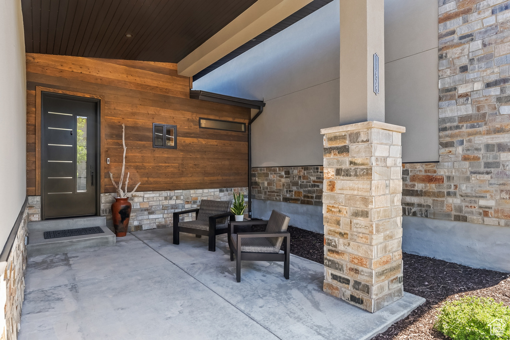 View of patio with an outdoor living space