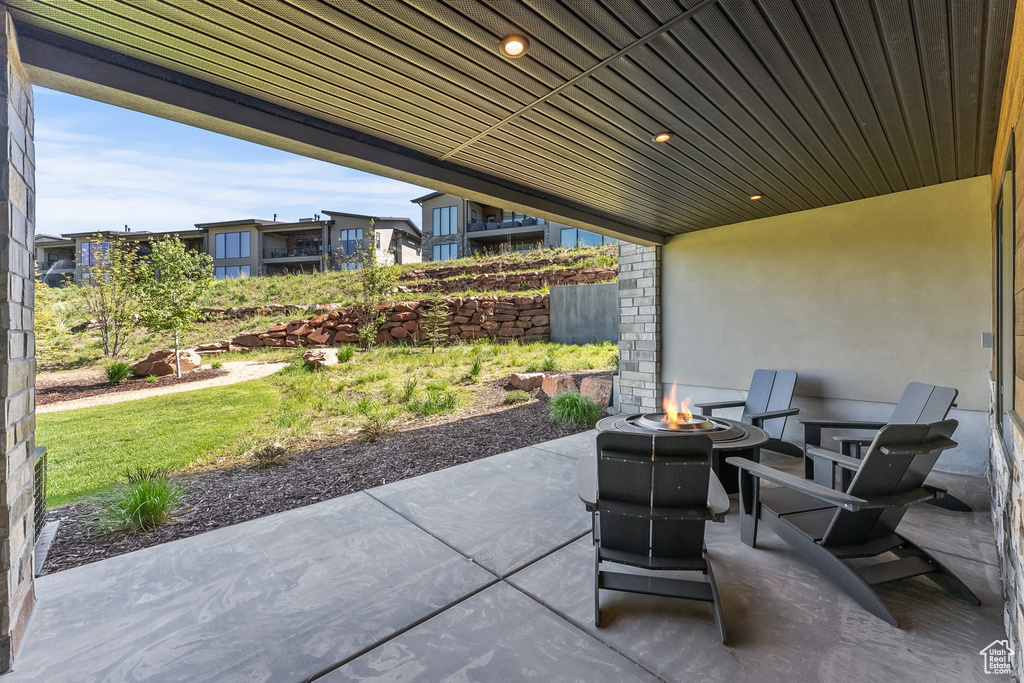 View of patio / terrace with an outdoor fire pit